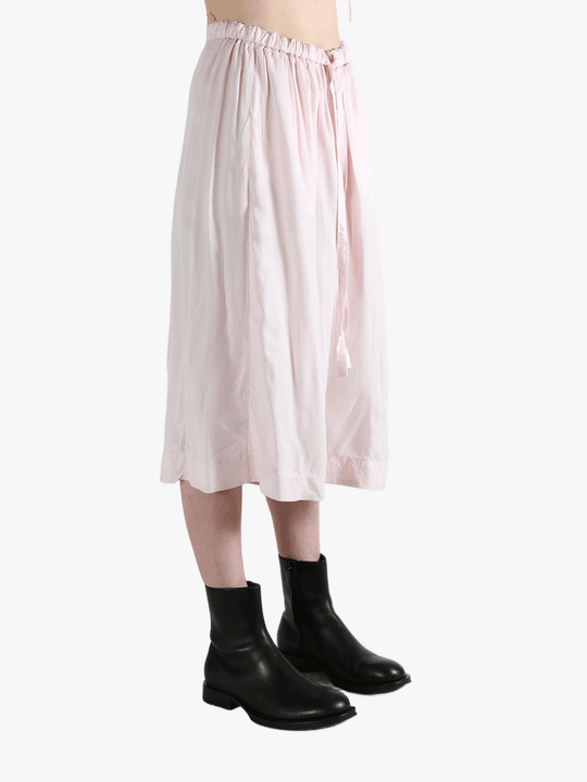 Pink pants worn by a person, showing the pants fit