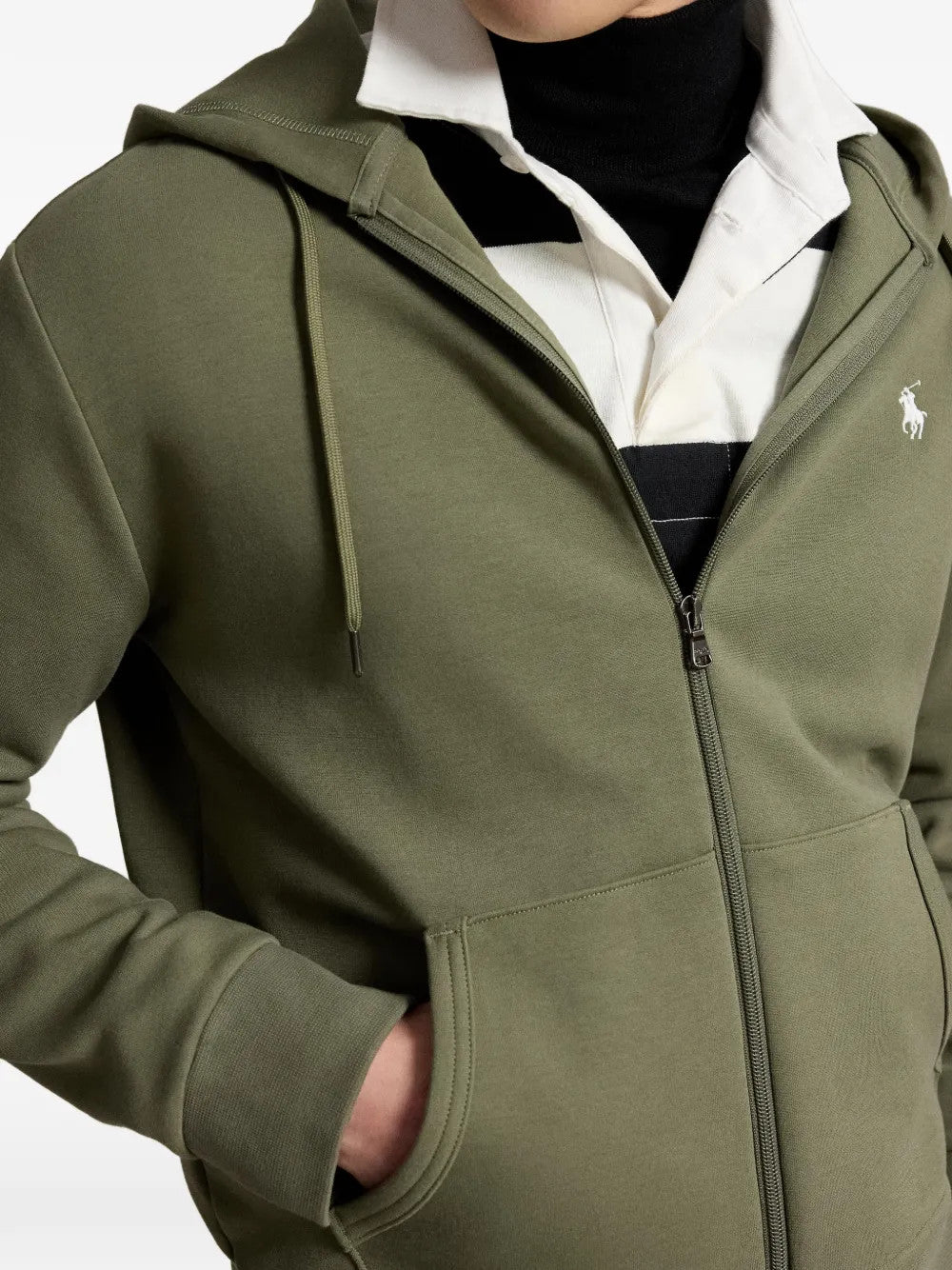 Green hoodie worn by a person, showing the hoodie fit