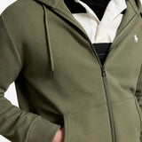 Green hoodie worn by a person, showing the hoodie fit