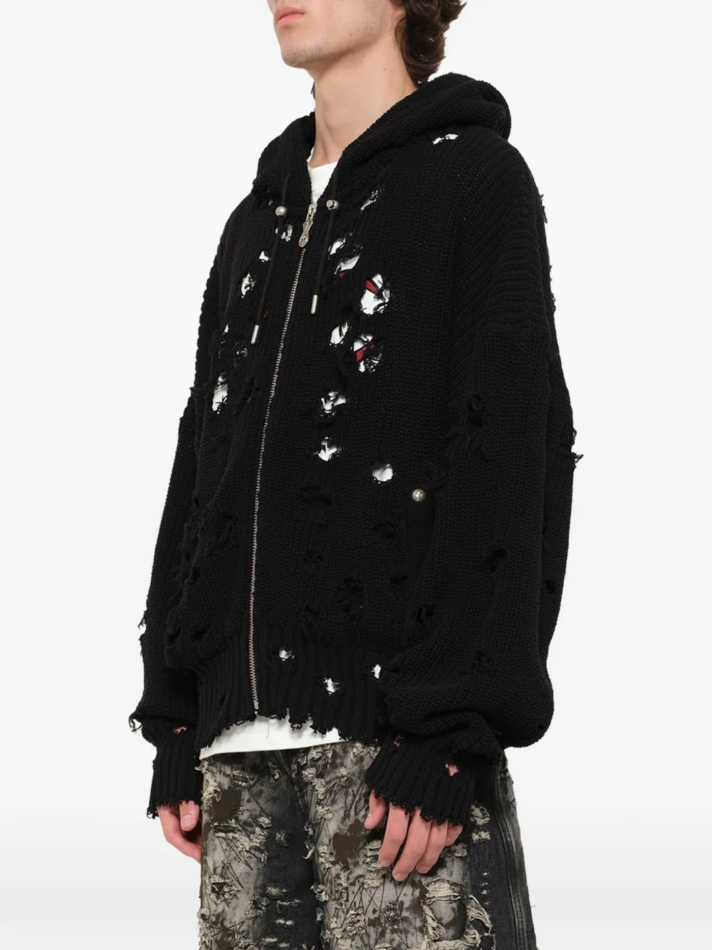 Black hoodie worn by a person, showing the hoodie fit