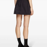 Black skirt worn by a person, showing the skirt fit