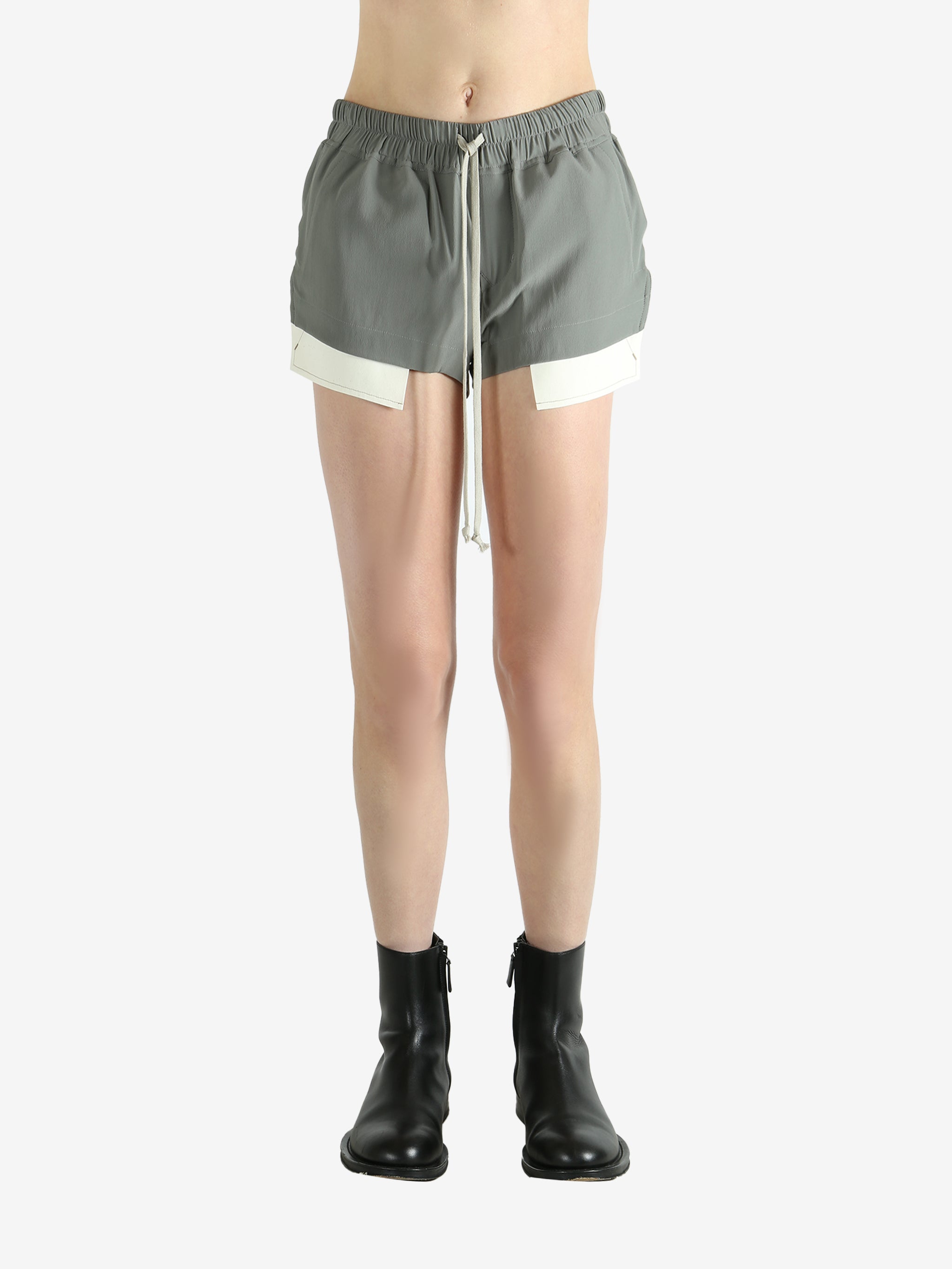 Grey shorts worn by a person, showing the shorts's fit