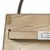 Close up of tan bag, showing texture of the Calf Leather fabric