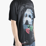 Black t-shirts worn by a person, showing the t-shirts fit