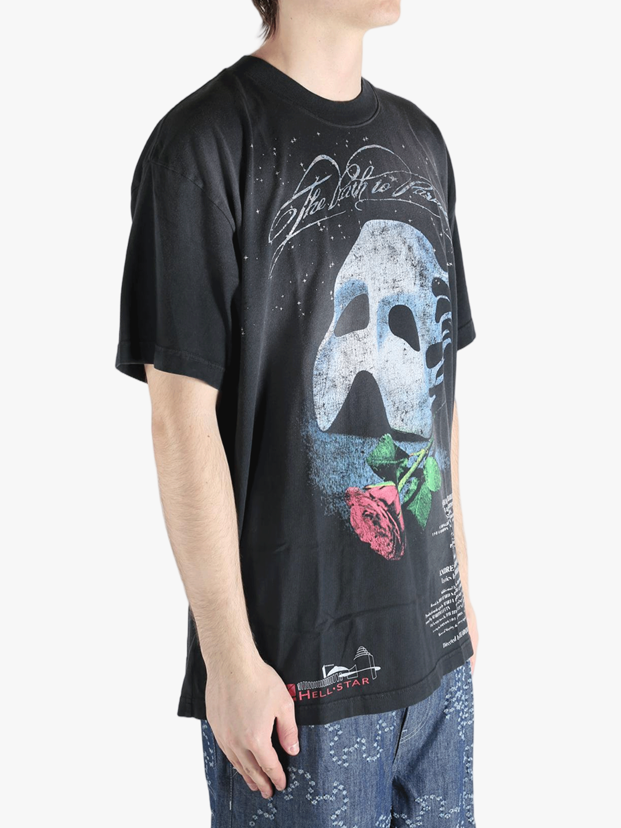 Black t-shirts worn by a person, showing the t-shirts fit