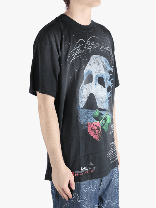 Black t-shirts worn by a person, showing the t-shirts fit