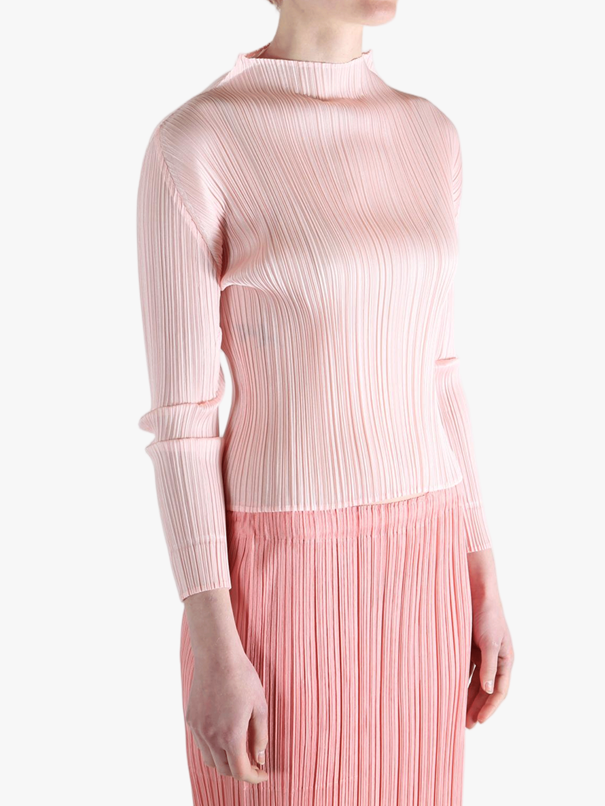 Pink shirt worn by a person, showing the shirt's fit