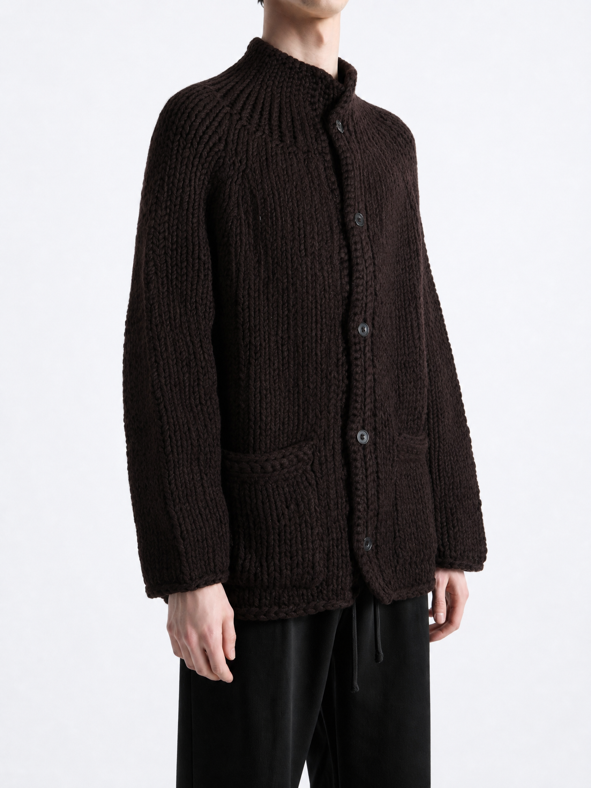 Brown knitwear worn by a person, showing the knitwear fit