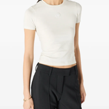 White tops worn by a person, showing the tops' fit