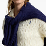 Tan knitwear worn by a person, showing the knitwear fit