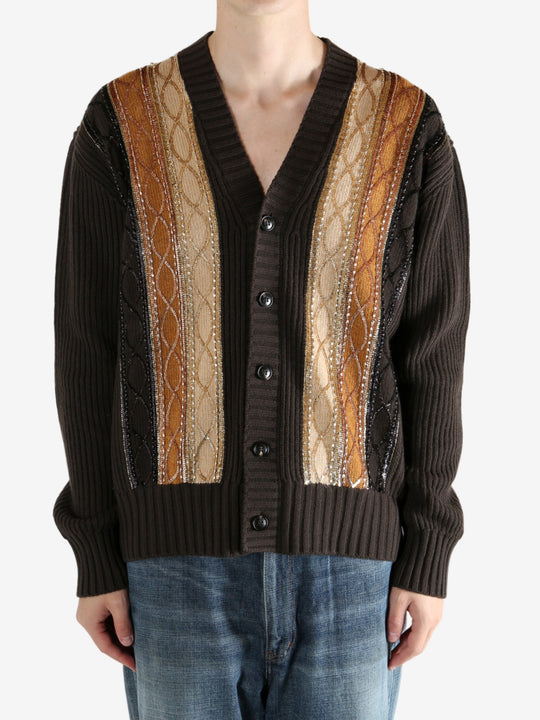 Brown sweater worn by a person, showing the sweater fit