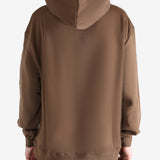 Brown hoodie worn by a person, showing the hoodie's fit