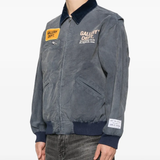 Blue jacket worn by a person, showing the jacket fit