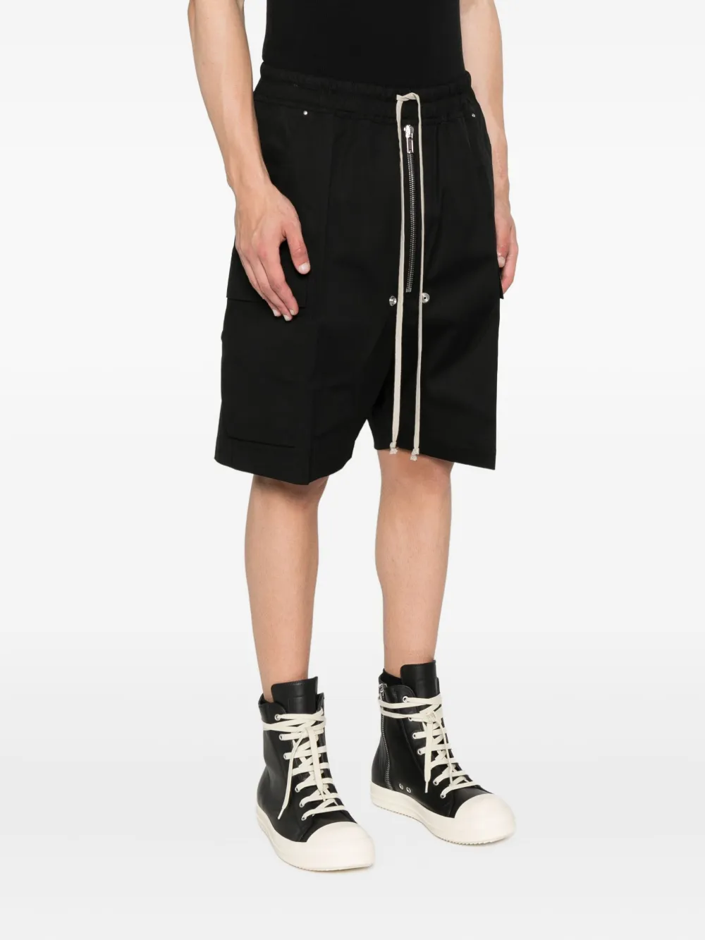 Black shorts worn by a person, showing the shorts fit