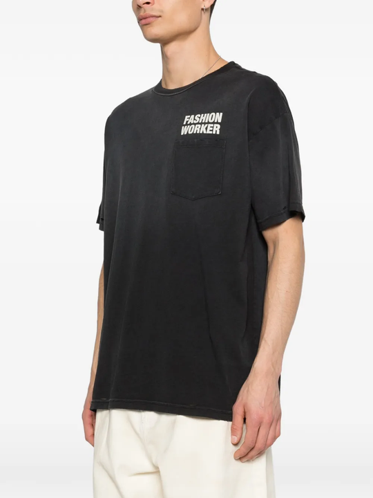 black t-shirt worn by a person, showing the t-shirt fit