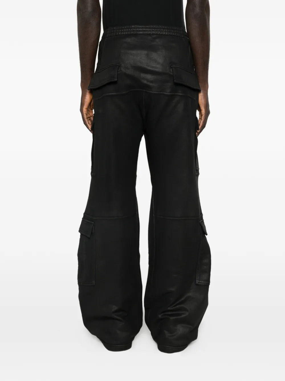 Black pants worn by a person, showing the pants fit