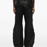 Black pants worn by a person, showing the pants fit