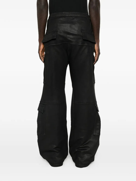 Black pants worn by a person, showing the pants fit