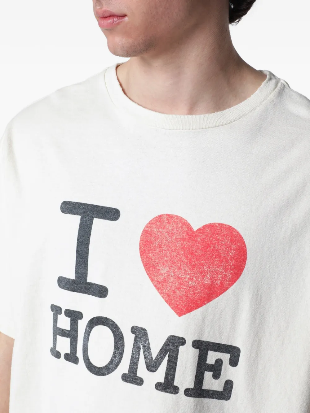 White t-shirt worn by a person, showing the t-shirt fit
