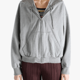 Grey jackets-coats worn by a person, showing the jackets-coats'fit