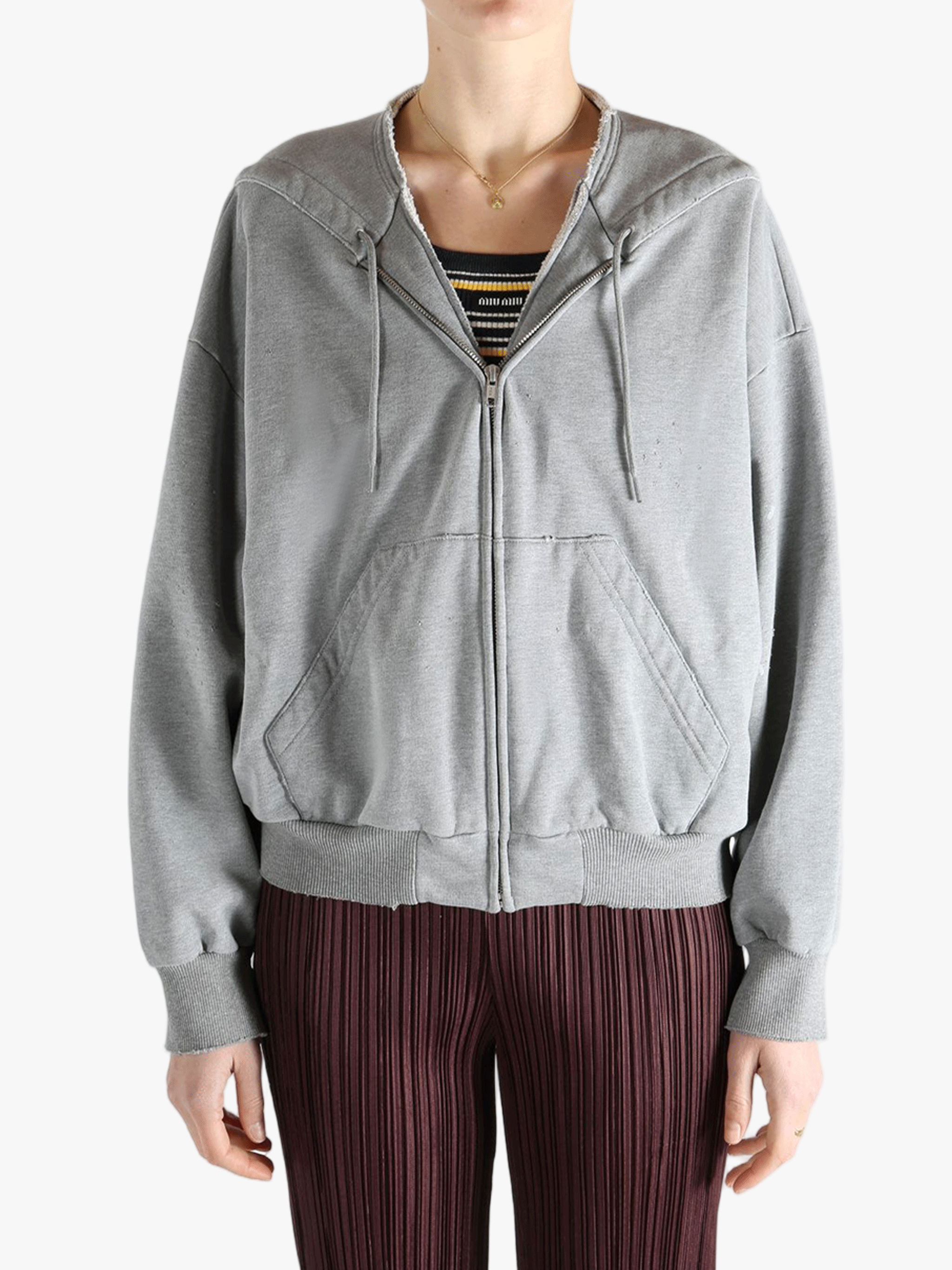 Grey jackets-coats worn by a person, showing the jackets-coats'fit