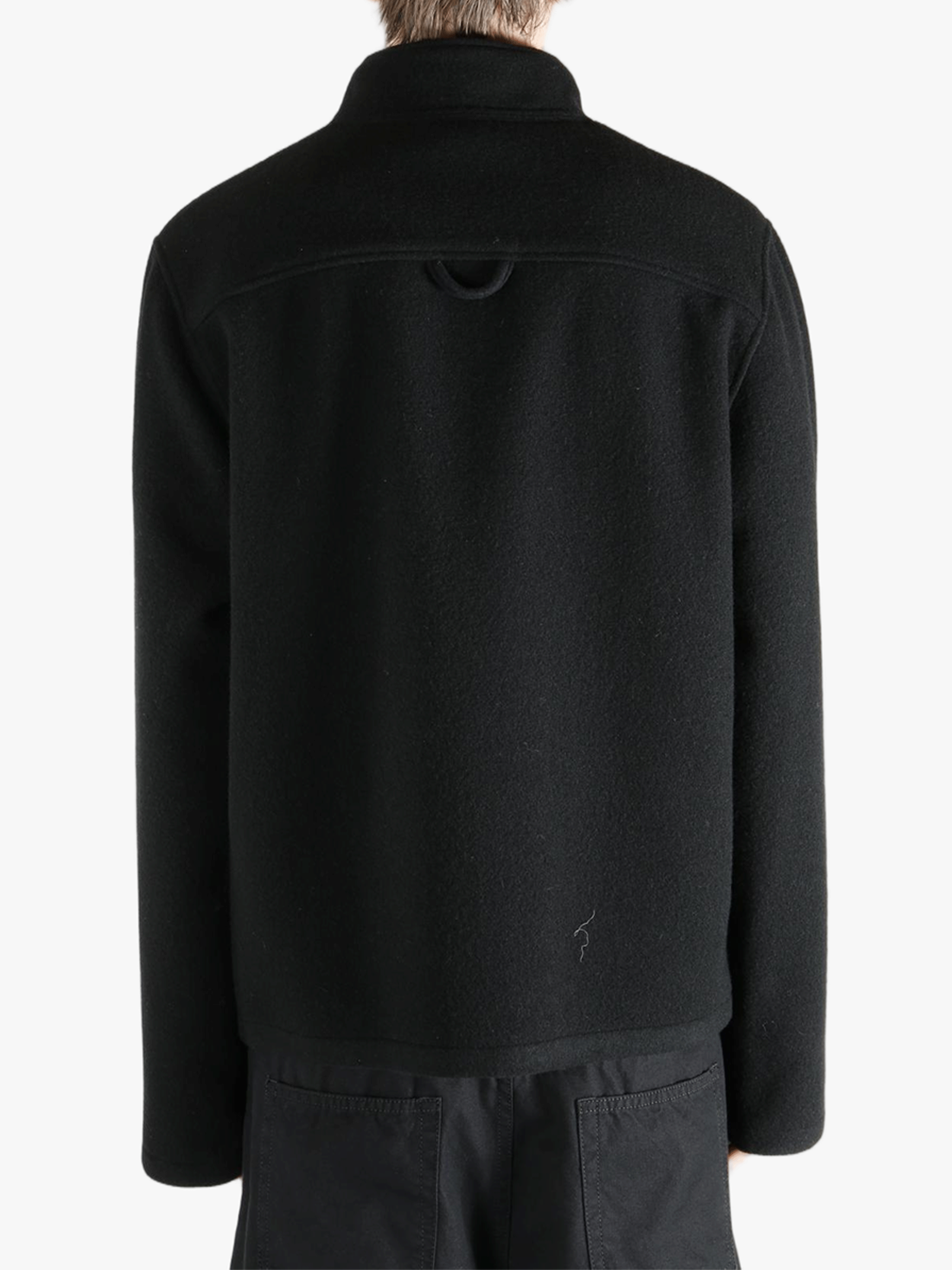 Black jacket worn by a person, showing the jacket's fit