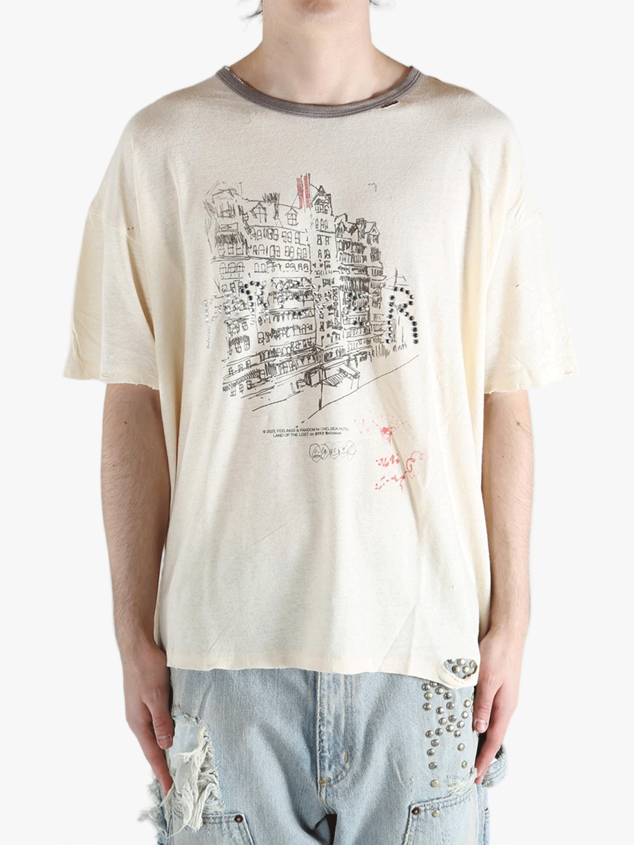 White t-shirt worn by a person, showing the shirt's fit