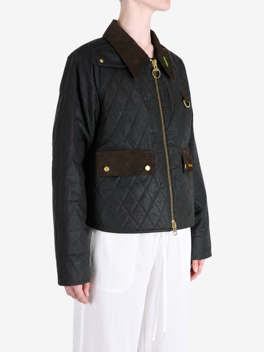 Black jacket worn by a person, showing the jacket fit