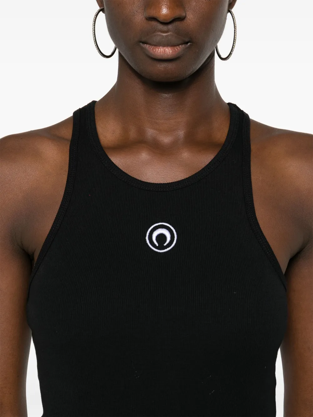 Close up of black tops, showing texture of the cotton fabric