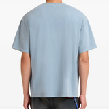 blue t-shirt worn by a person, showing the t-shirt fit