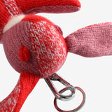Close up of red keychain, showing texture of the metal clip 