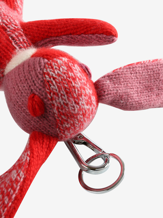 Close up of red keychain, showing texture of the metal clip 