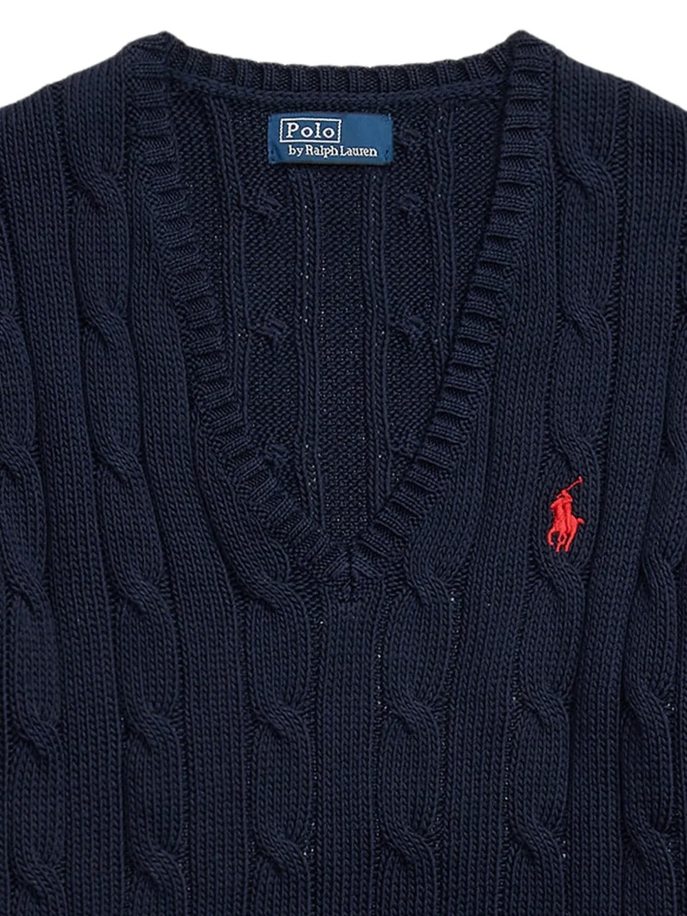 Close up of navy pullover, showing texture of the cotton fabric