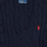 Close up of navy pullover, showing texture of the cotton fabric