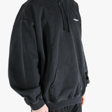 Black sweats-hoodies worn by a person, showing the fit