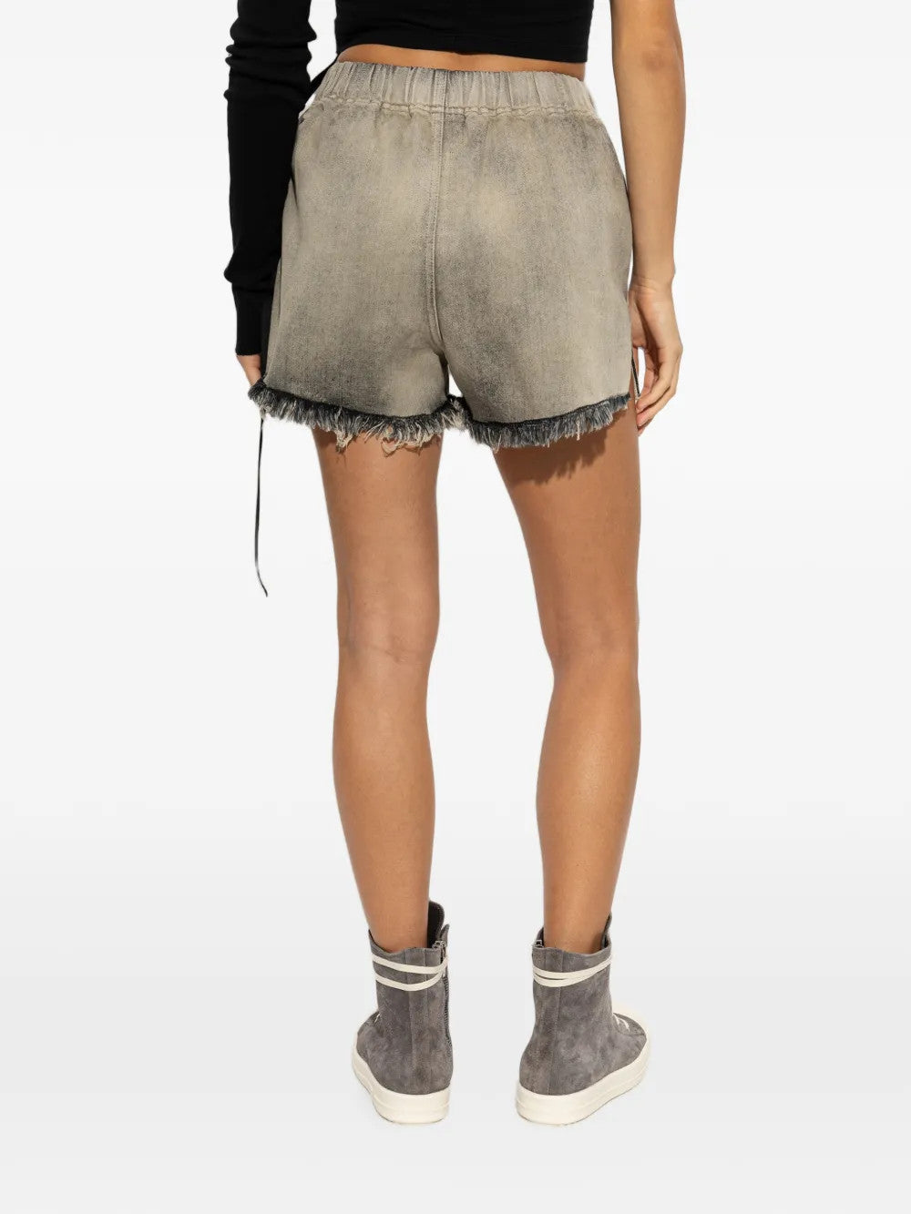 Grey shorts worn by a person, showing the shorts fit
