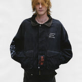 Black jacket worn by a person, showing the jacket's fit