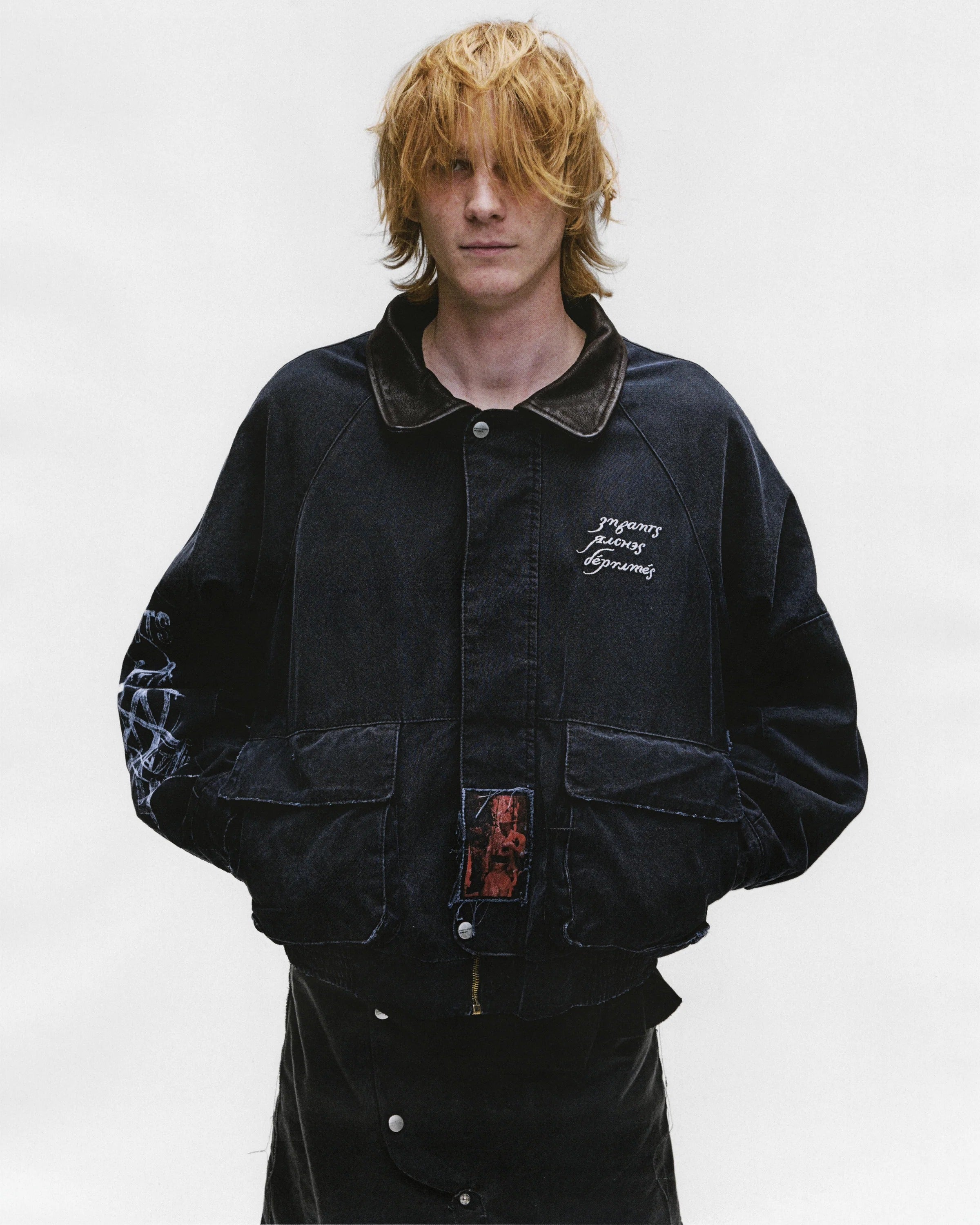 Black jacket worn by a person, showing the jacket's fit