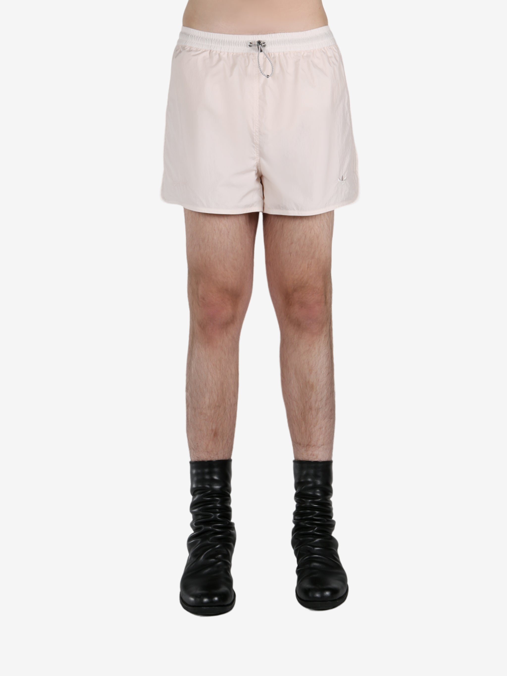 White short worn by a person, showing the short fit