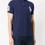 Navy T-shirt worn by a person, showing the shirt's fit