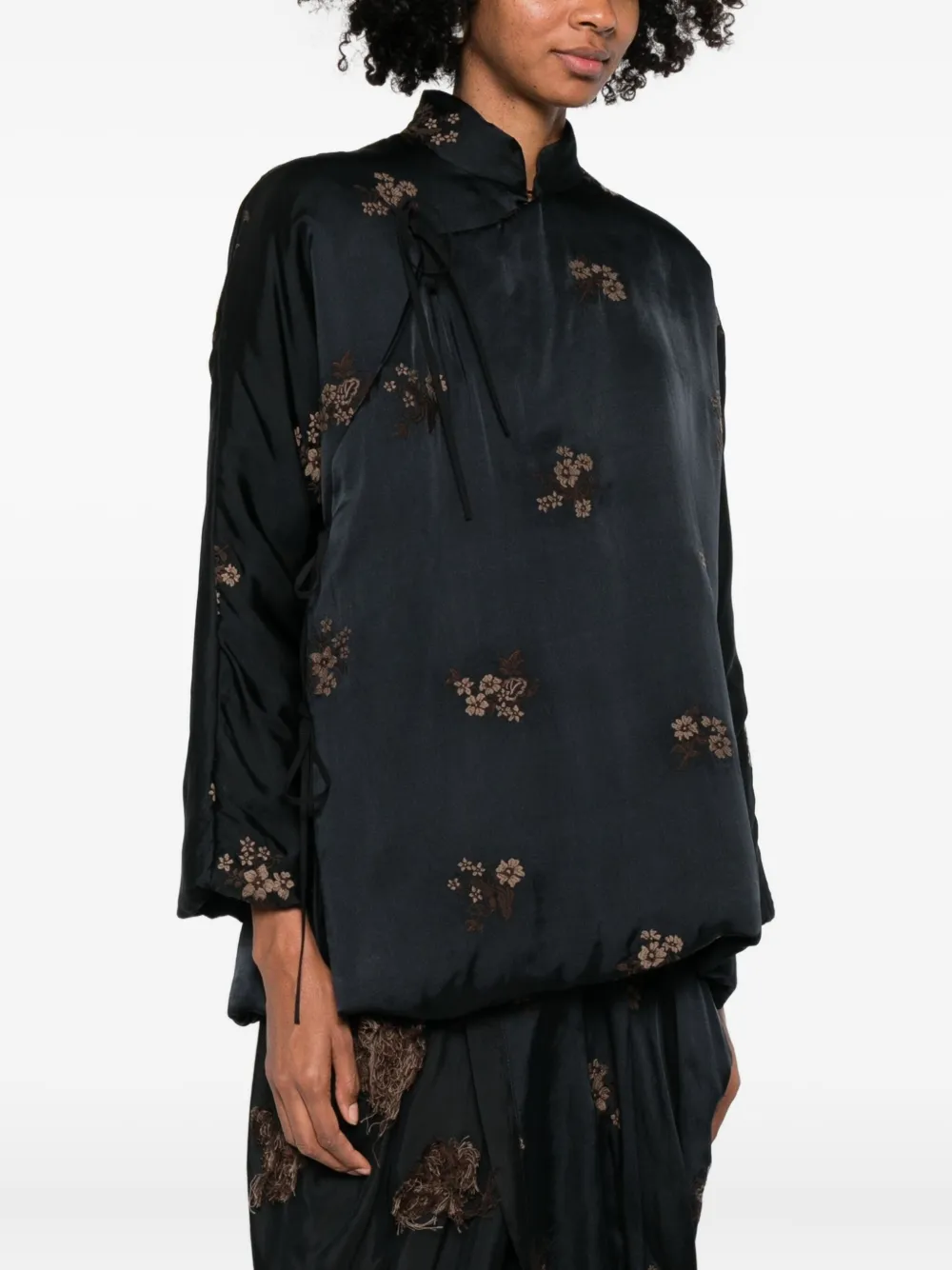 Black jackets worn by a person, showing the jackets fit