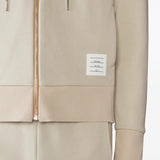 Close up of tan hoodies, showing texture of the cotton fabric