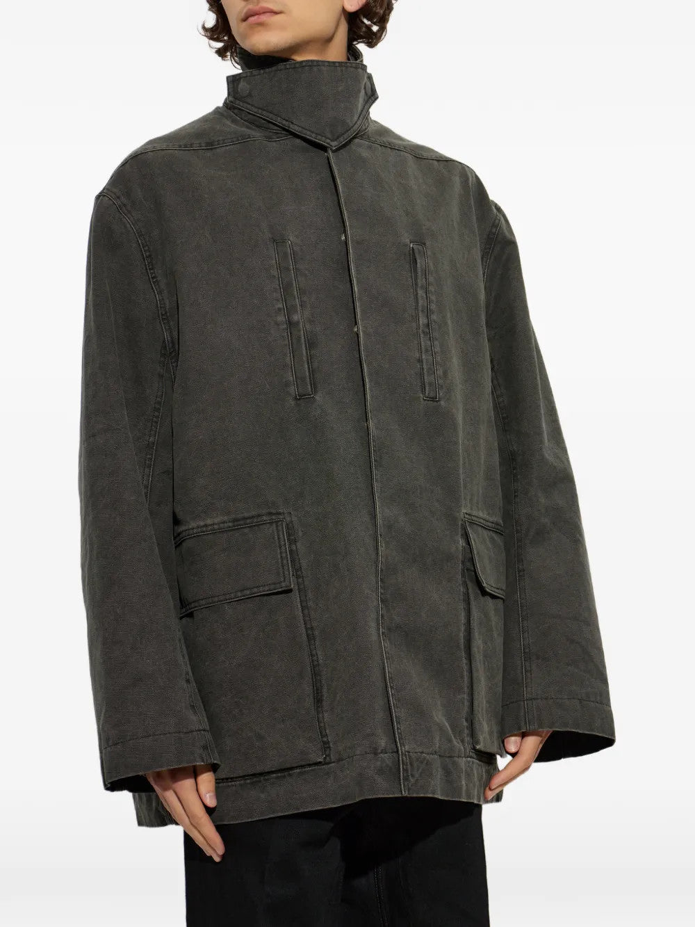 Grey jacket worn by a person, showing the jacket fit