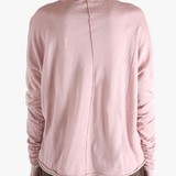 Pink top worn by a person, showing the top fit
