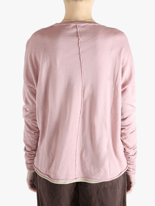 Pink top worn by a person, showing the top fit