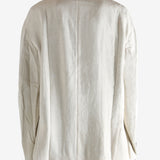 White blazer worn by a person, showing the blazer's fit