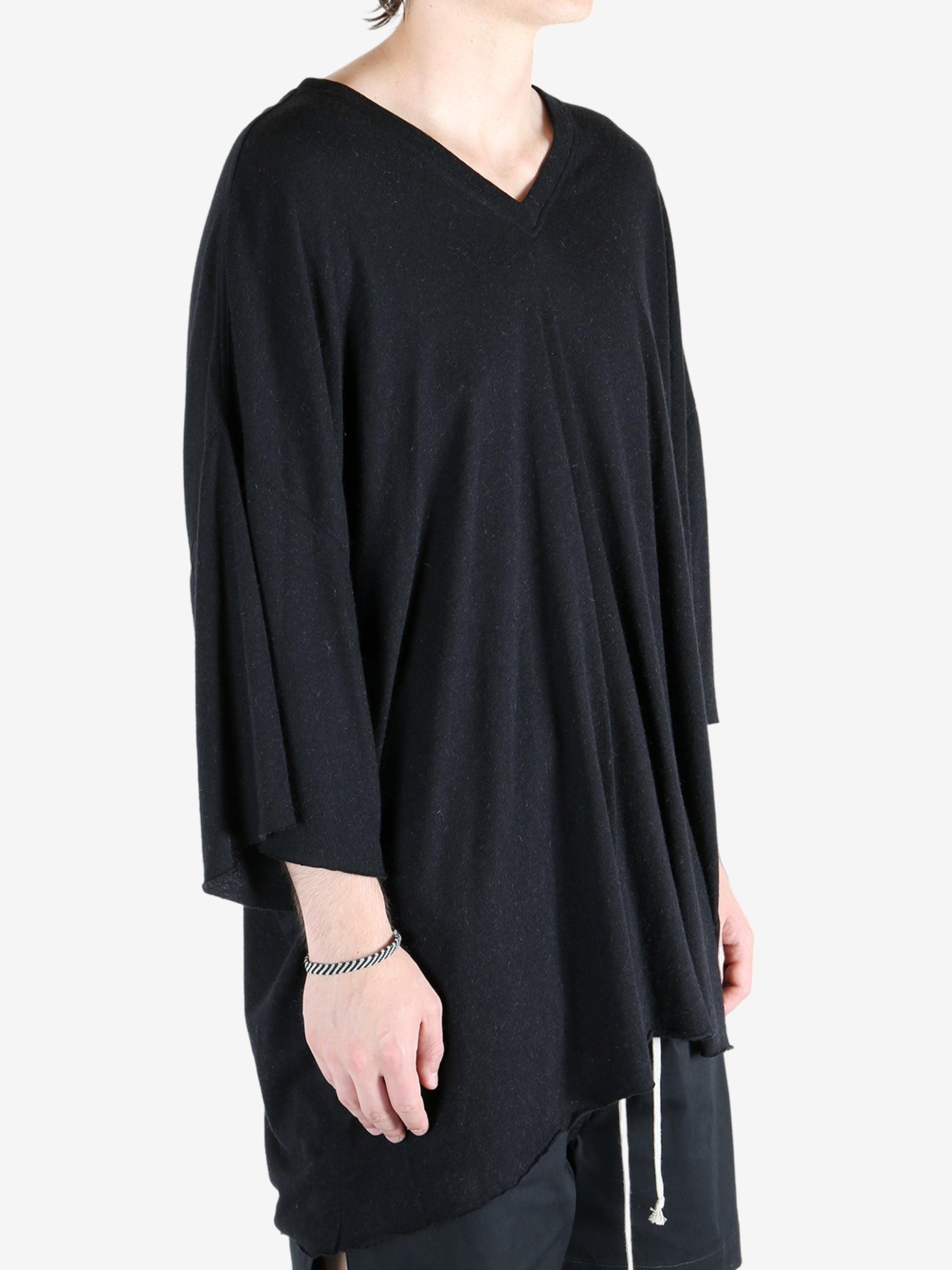 Black t-shirt worn by a person, showing the t-shirt fit