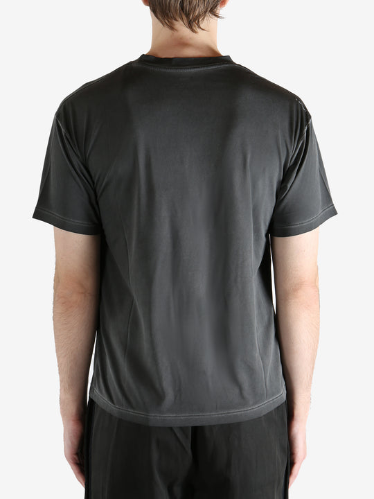 Black t-shirt worn by a person, showing the shirt's fit