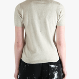 White t-shirts worn by a person, showing the t-shirts fit