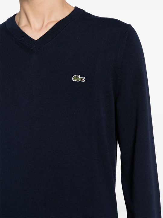 Close up of navy sweater, showing texture of the cotton fabric